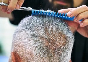 Northampton Massachusetts senior customer getting haircut from barber